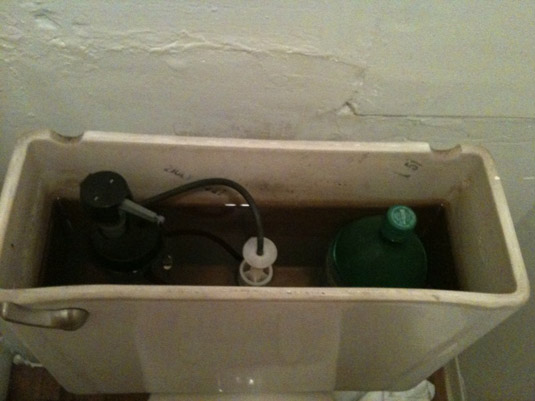 Use 2 litter soda bottle to conserve water every time you flush the toilet Soda bottle to conserve water on toilet flush